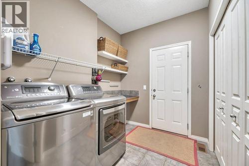 360 Parkmere Green, Chestermere, AB - Indoor Photo Showing Laundry Room