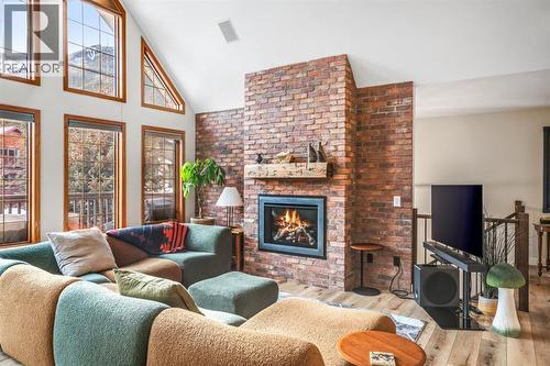 108 Lougheed Circle, Banff, AB - Indoor Photo Showing Living Room With Fireplace