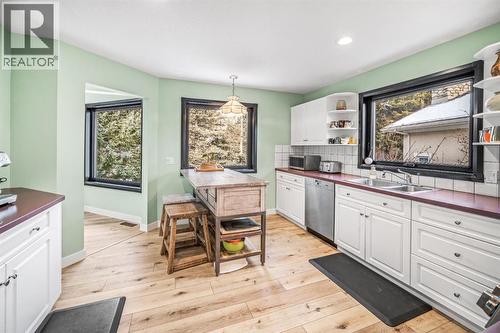 108 Lougheed Circle, Banff, AB - Indoor Photo Showing Kitchen With Double Sink