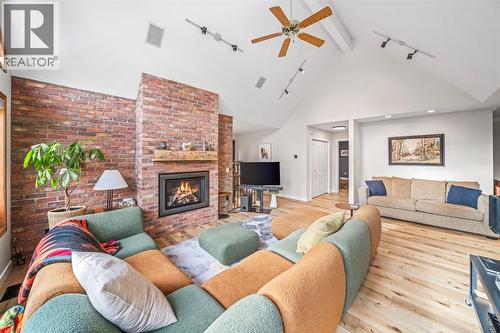 108 Lougheed Circle, Banff, AB - Indoor Photo Showing Living Room With Fireplace