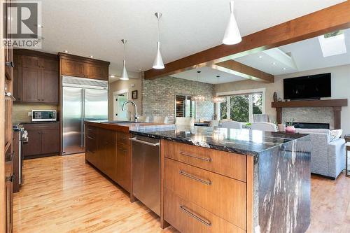 664 29 Avenue Nw, Calgary, AB - Indoor Photo Showing Kitchen With Fireplace With Stainless Steel Kitchen With Upgraded Kitchen