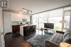 Living Room and Kitchen with Hardwood Floors - 