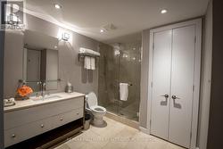 Spa Bathroom with Marble and Glass Shower - 