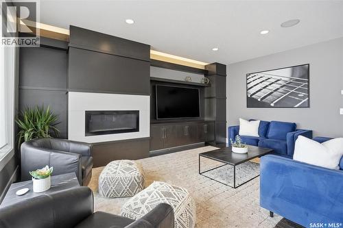 343 Mahabir Court, Saskatoon, SK - Indoor Photo Showing Living Room With Fireplace