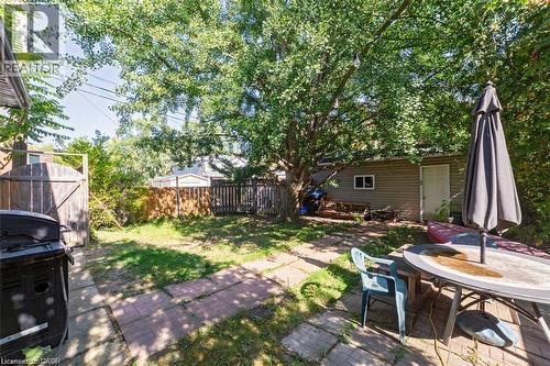 Fenced backyard featuring a patio and outdoor dining area - 41 Paradise Road S, Hamilton, ON - Outdoor