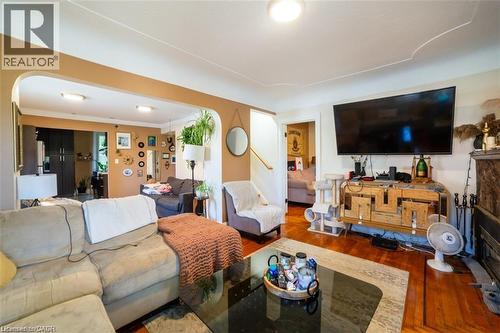 Living area with wood finished floors and ornamental molding - 41 Paradise Road S, Hamilton, ON - Indoor Photo Showing Living Room