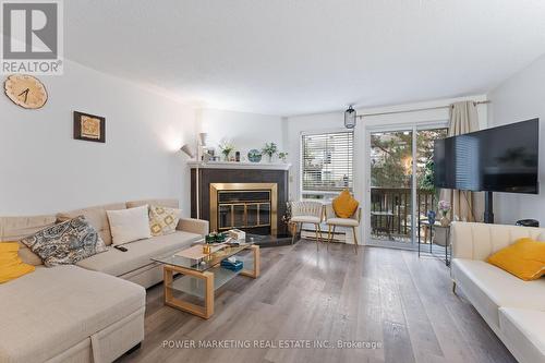 B - 6702 Jeanne D'Arc Boulevard N, Ottawa, ON - Indoor Photo Showing Living Room With Fireplace