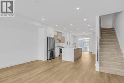 Luxury vinyl plank in living areas. Photo of a similar home in the community. - 