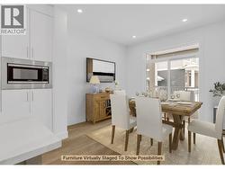 Dining Area - Virtually staged to show possibilities. Photo of a similar home in the community. - 