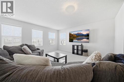 Versatile upper bonus room for movie nights, play space, or home office - 254 Howse Drive Ne, Calgary, AB - Indoor Photo Showing Living Room
