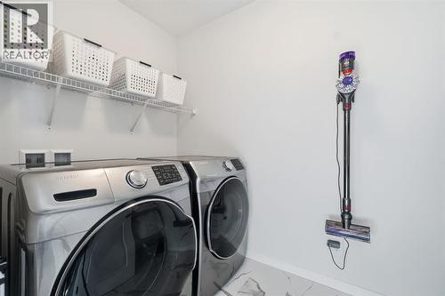 Large laundry room - 254 Howse Drive Ne, Calgary, AB - Indoor Photo Showing Laundry Room