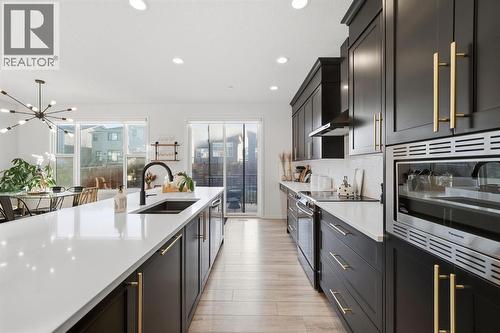 Expansive island perfect for entertaining and everyday meals - 254 Howse Drive Ne, Calgary, AB - Indoor Photo Showing Kitchen With Double Sink With Upgraded Kitchen