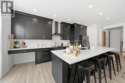 Ample cabinetry and pantry storage for both style and function - 254 Howse Drive Ne, Calgary, AB - Indoor Photo Showing Kitchen With Upgraded Kitchen