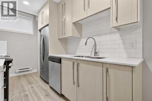 128 Corner Meadows Gate Ne, Calgary, AB - Indoor Photo Showing Kitchen With Double Sink