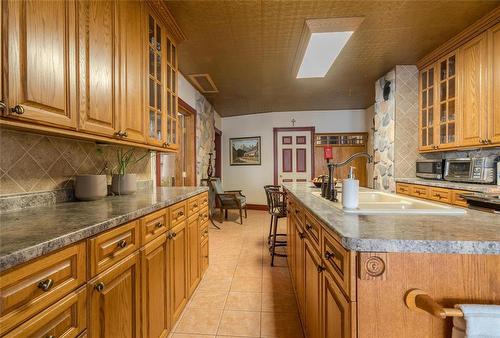 135 Third Avenue, Letellier, MB - Indoor Photo Showing Kitchen With Double Sink