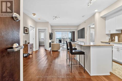 View from front door to LV room & balcony - 408 - 615 Longfields Drive, Ottawa, ON - Indoor Photo Showing Kitchen With Upgraded Kitchen