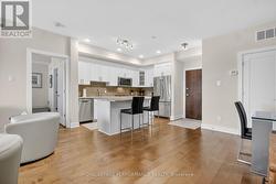 Main entrance view to entry door and kitchen - 