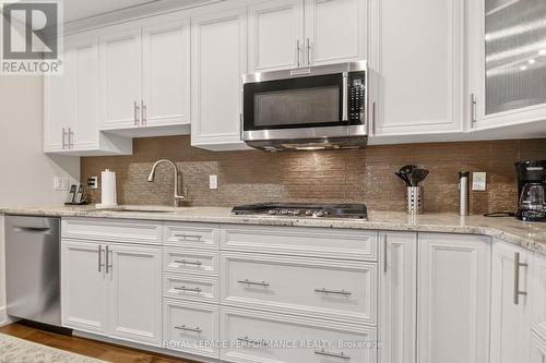 Built in microwave - 408 - 615 Longfields Drive, Ottawa, ON - Indoor Photo Showing Kitchen With Upgraded Kitchen