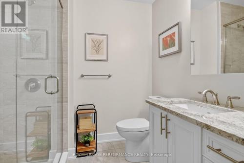 Glass shower door, granite counter. - 408 - 615 Longfields Drive, Ottawa, ON - Indoor Photo Showing Bathroom