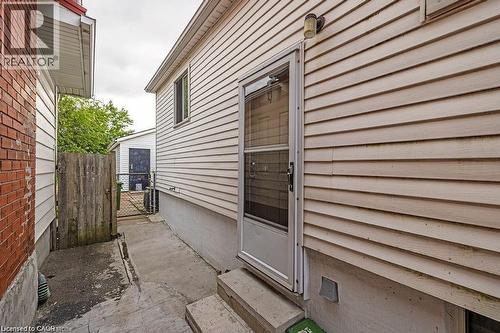 View of exterior entry featuring crawl space - 201 East 23Rd. Street, Hamilton, ON - Outdoor With Exterior