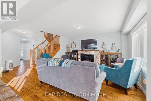 23 Doon Creek Street, Kitchener, ON - Indoor Photo Showing Living Room With Fireplace