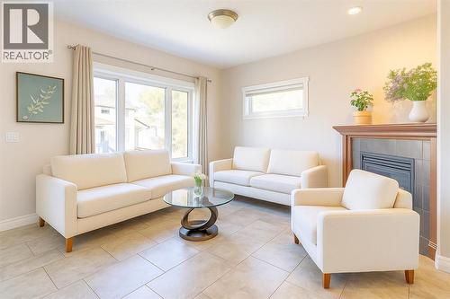 Living Room (virtual staged) - 1421 40 Street Sw, Calgary, AB - Indoor Photo Showing Living Room With Fireplace