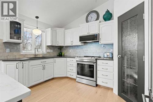 LOTS OF UPPER AND LOWER CABINETS - 140 Allen Crescent, Vulcan, AB - Indoor Photo Showing Kitchen With Upgraded Kitchen