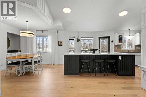 ADDITIONAL SEATING AT THE OVERSIZED ISLAND - 140 Allen Crescent, Vulcan, AB - Indoor Photo Showing Dining Room