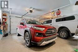 OVERSIZED HEATED GARAGE - 24 X 24 - HEATED FLOORS AND A 220V OUTLET - 