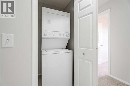 122 Panamount Drive Nw, Calgary, AB - Indoor Photo Showing Laundry Room