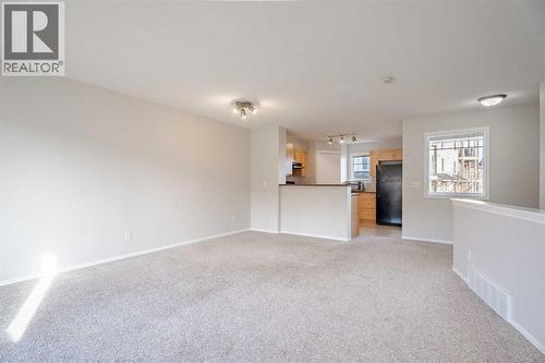 open concept in living, dining n room and kitchen - 122 Panamount Drive Nw, Calgary, AB - Indoor Photo Showing Other Room