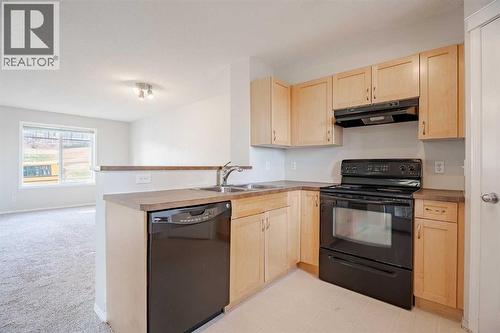 122 Panamount Drive Nw, Calgary, AB - Indoor Photo Showing Kitchen With Double Sink