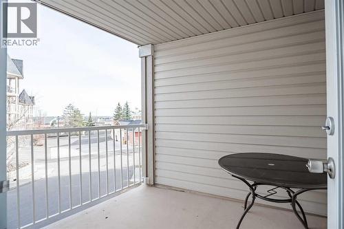 covered patio off the kitchen - 122 Panamount Drive Nw, Calgary, AB - Outdoor With Exterior