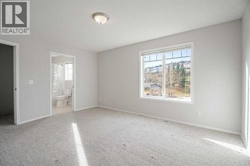 primary bedroom has the direct access to the 4 pce bathroom - 122 Panamount Drive Nw, Calgary, AB - Indoor Photo Showing Other Room
