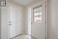 basement access to the back alley, second door direct access to the garage - 
