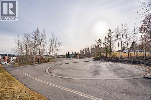 this unit faces to the open green space with walking trial - 122 Panamount Drive Nw, Calgary, AB - Outdoor With View