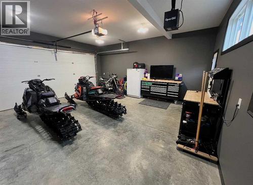 85 Reynolds Road, Sylvan Lake, AB - Indoor Photo Showing Garage