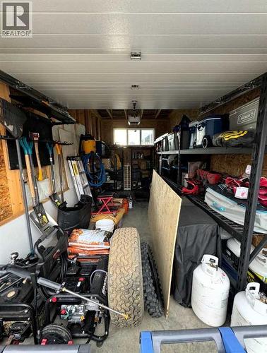 85 Reynolds Road, Sylvan Lake, AB - Indoor Photo Showing Garage
