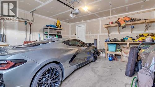 1120 Windhaven Close Sw, Airdrie, AB - Indoor Photo Showing Garage
