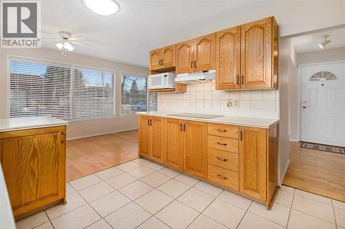 Skylight Brings Additional Natural Light During the Day - 1423 18A Street Ne, Calgary, AB - Indoor Photo Showing Kitchen