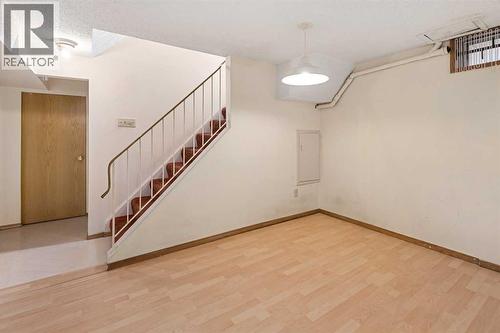 Stairs to Basement. Back Door at the top of Stairs - 1423 18A Street Ne, Calgary, AB - Indoor Photo Showing Other Room