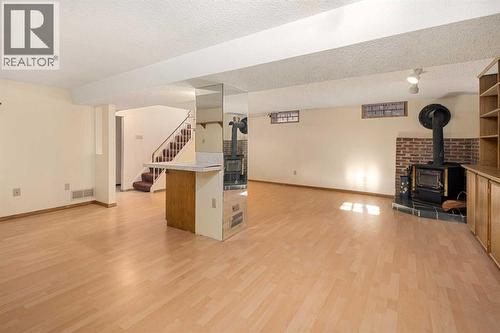 Wood Burning Stove to enjoy the cool nights in comfort - 1423 18A Street Ne, Calgary, AB - Indoor With Fireplace