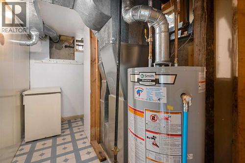 Deep Freezer. Hot Water Tank -2 years old - 1423 18A Street Ne, Calgary, AB - Indoor Photo Showing Basement