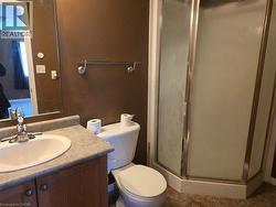 Bathroom with a stall shower and vanity - 