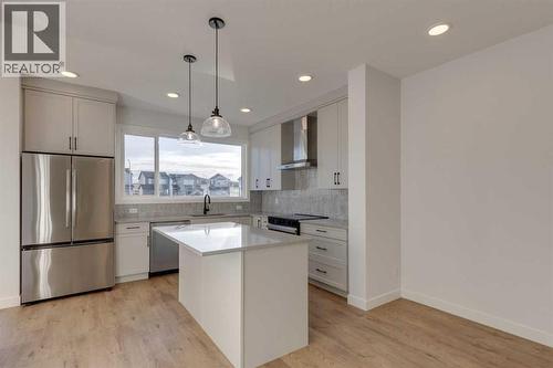 367 Fireside Drive, Cochrane, AB - Indoor Photo Showing Kitchen With Upgraded Kitchen
