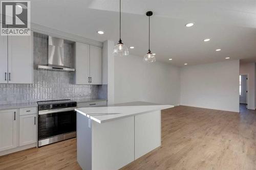 367 Fireside Drive, Cochrane, AB - Indoor Photo Showing Kitchen With Upgraded Kitchen