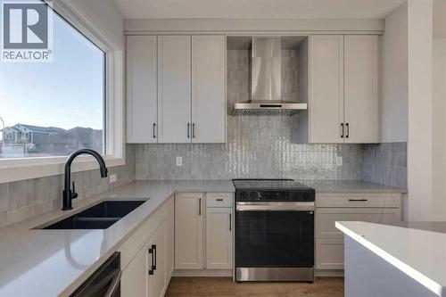 367 Fireside Drive, Cochrane, AB - Indoor Photo Showing Kitchen With Double Sink With Upgraded Kitchen