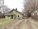 standing on the sidewalk looking down the driveway, which leads to the rear parking area. - 3708 25 Avenue, Vernon, BC  - Outdoor 