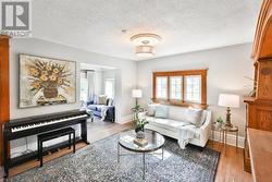 Living Room Open To Den, Large Windows - 