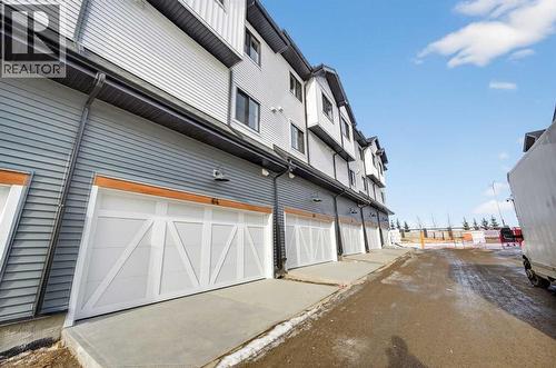 Double attached garage - 64 Creekside Drive Sw, Calgary, AB - Outdoor With Exterior
